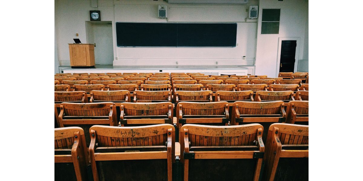 university classroom showing a blackboard and chairs